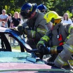Members of ther Osawatomie Fire Department show off the tools used to extricate a victim from an automobile during the open house Saturday.