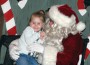 Jaylynn Baldwin gets a hug from Santa Claus Saturday morning. Santa arrived in the morning to take pictures with eager kids and shoppers enjoyed the many craft booths during the Osawatomie Christmas celebration at the City Auditorium.