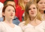 Miranda Ferrell and Abigail Dickinson perform with the seventh and eighth-grade choir Wenesday night.