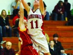 Tess Newport leans in for a basket against the Jayhawks.