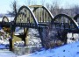 The Creamery Bridge built over the Marais des Cygne River on Osawatomie's north side in 1931 is one of eight triple rainbow arch bridges in Kansas.