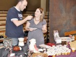 Q-104 FM personality Shane McClintock visits with Scentsy independent consultant Tessa Osborne about her product line during the Third Annual Home and Business Expo on Saturday at City Auditorium. McClintock interviewed exhibitors throughout the show.