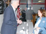 Kansas Rep. Bill Feuerborn speaks with Debby Stout following hte legislative breakfast Saturday morning.