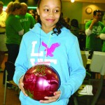 Osawatomie Middle School seventh grader and Little, Alicia Dillard, prepared with other Littles in other lanes to roll to begin the Bowl For Kids Sake event Saturday in Olathe